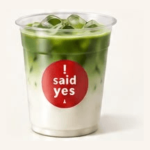 Iced Honey Matcha Latte: deep green matcha layered over milk in a clear cup