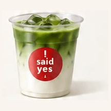 Iced Vanilla Matcha Latte: green matcha layered over creamy vanilla milk in a clear cup